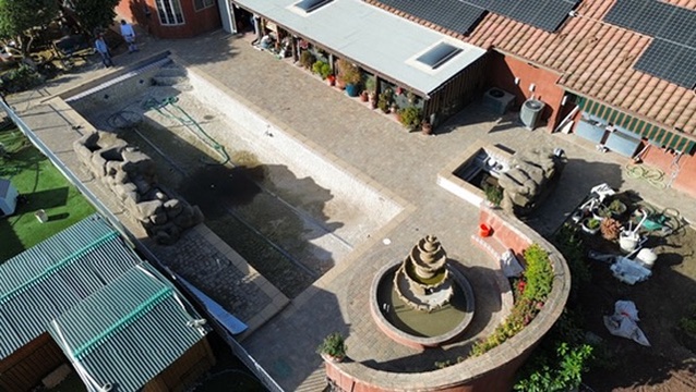 Paver courtyard with water feature project in Los Angeles County by Evergreen Landscaping